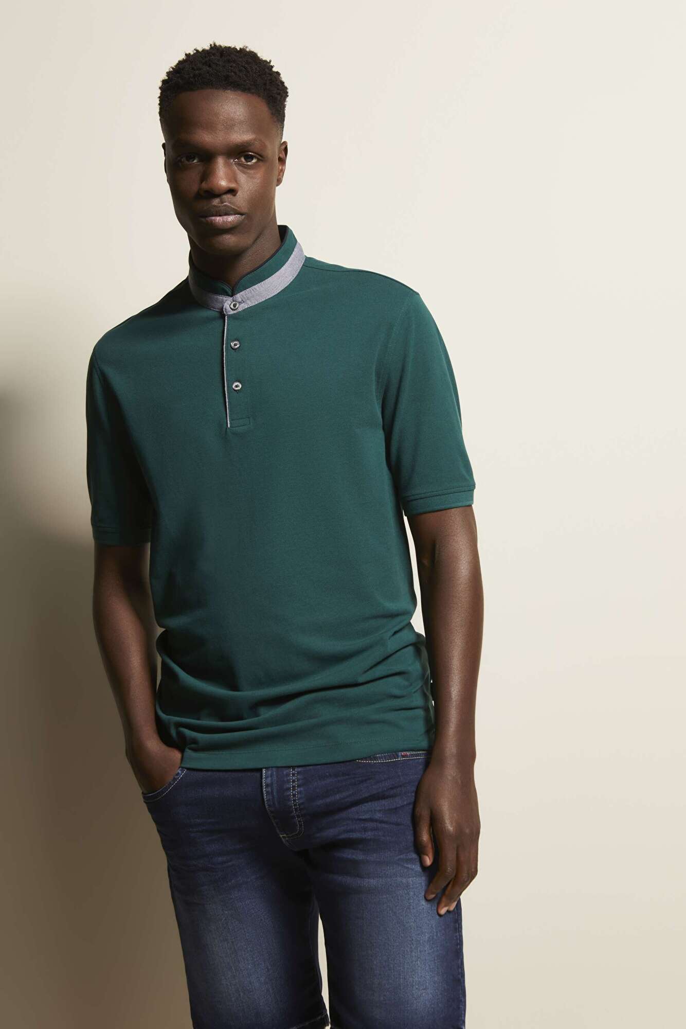 Polo shirt with band collar in bottle green - View: Model front